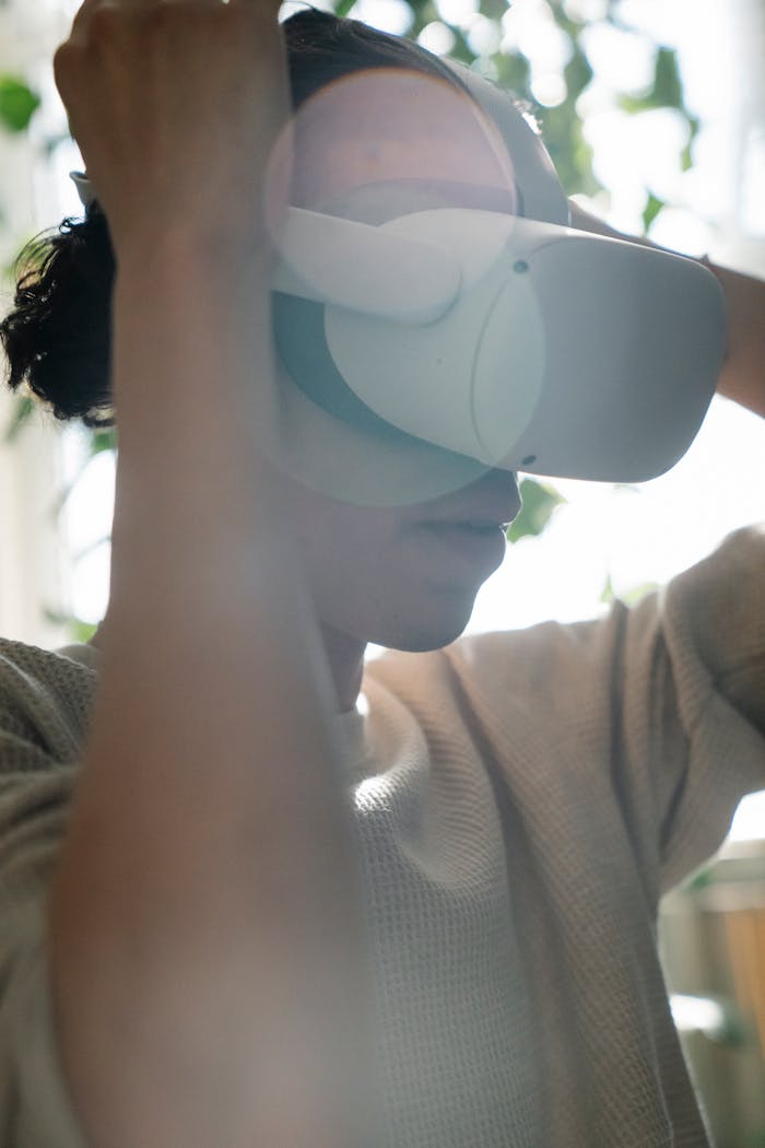 A woman adjusts her VR headset with sun flare emphasizing a tech-savvy and immersive experience.